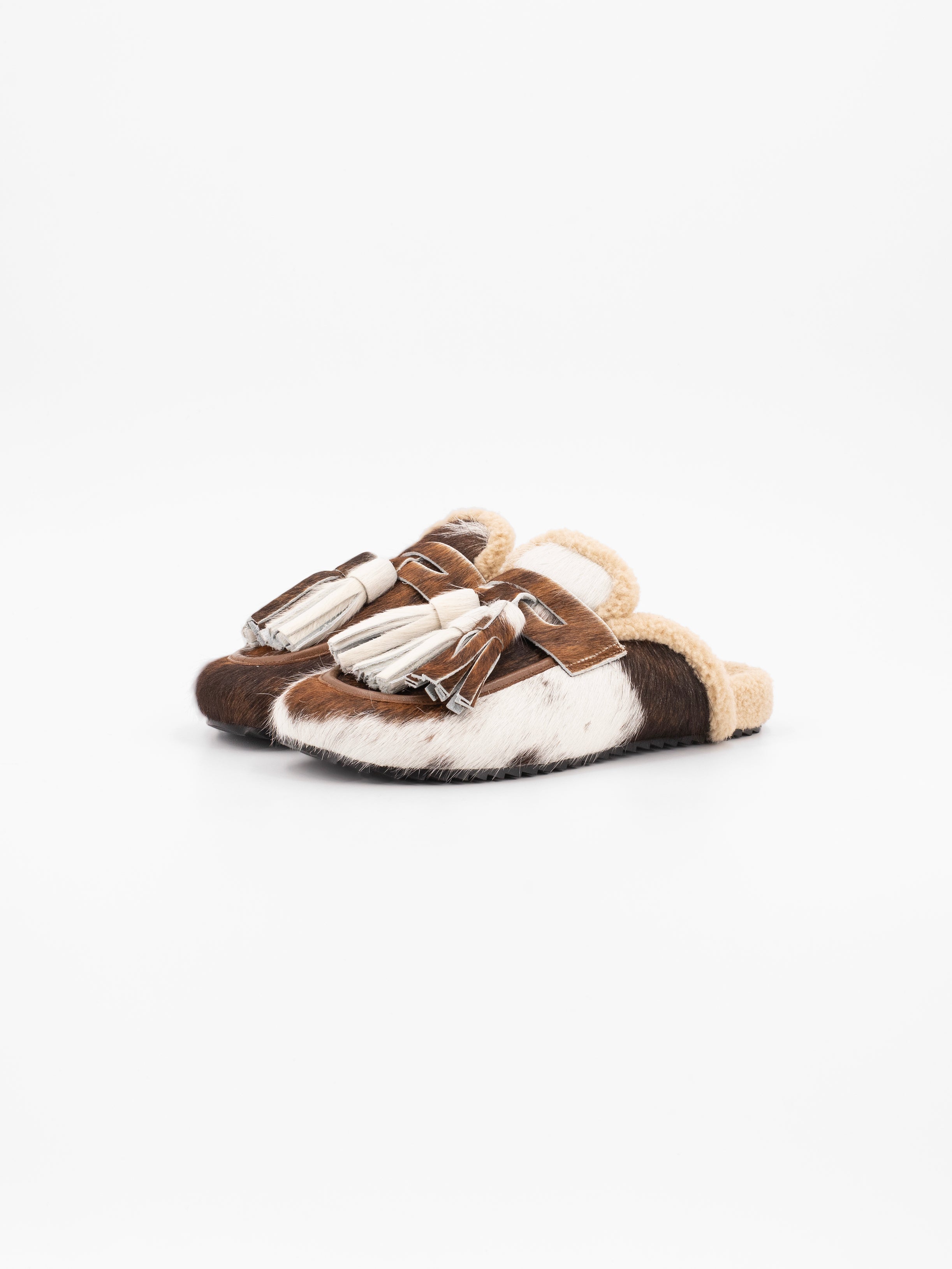 ARIANA COWHAIR TASSELED MULE SLIPPER