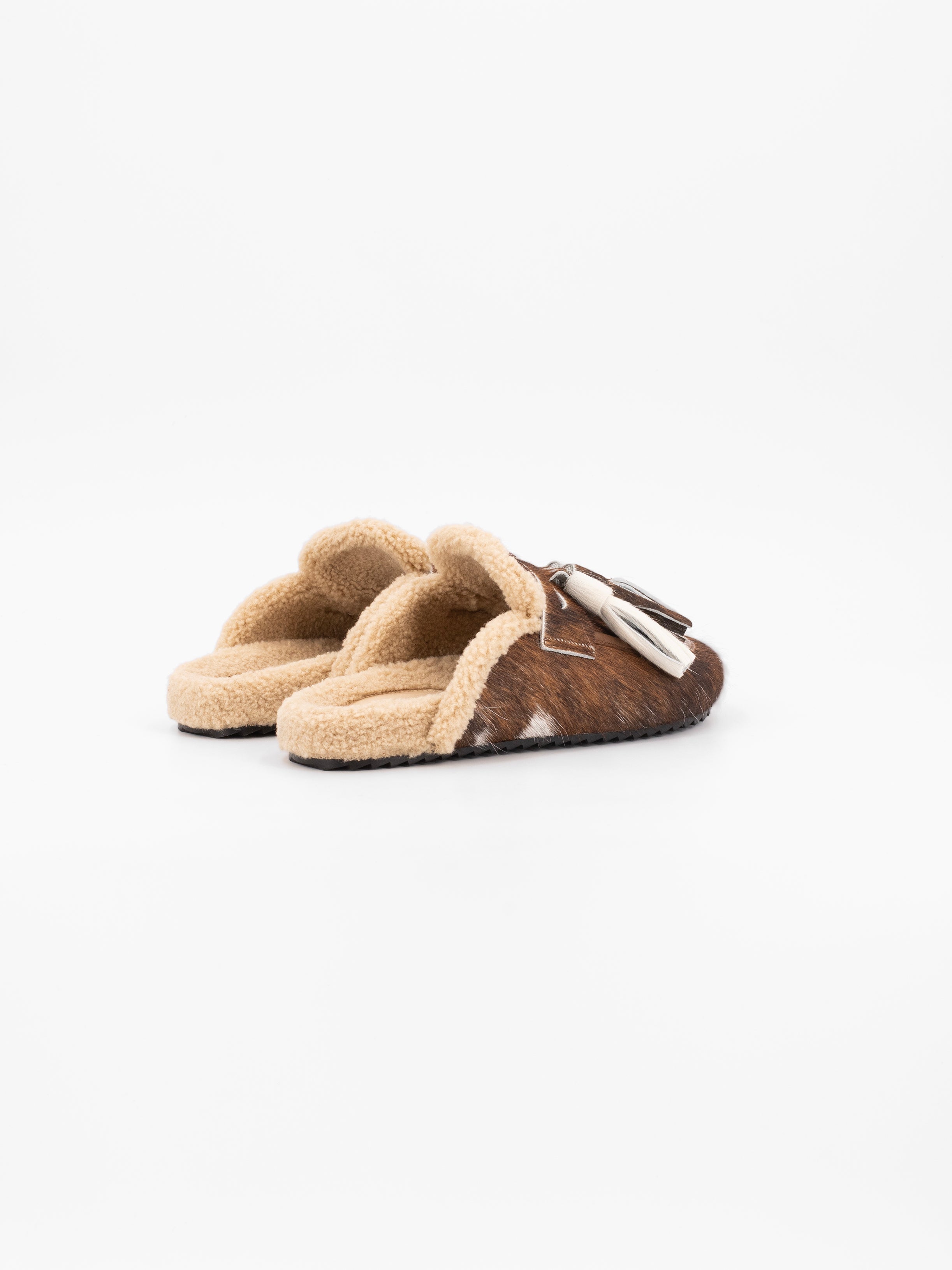 ARIANA COWHAIR TASSELED MULE SLIPPER